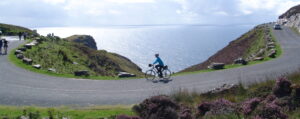 Staff member Cormac cycling at Sliabh Liag (Slieve League)