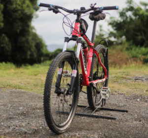 Image of a mountain bike showing wide tires and suspension which makes it ideal for travelling over rough terrain