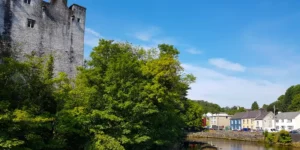 Castle in trees with river and Street