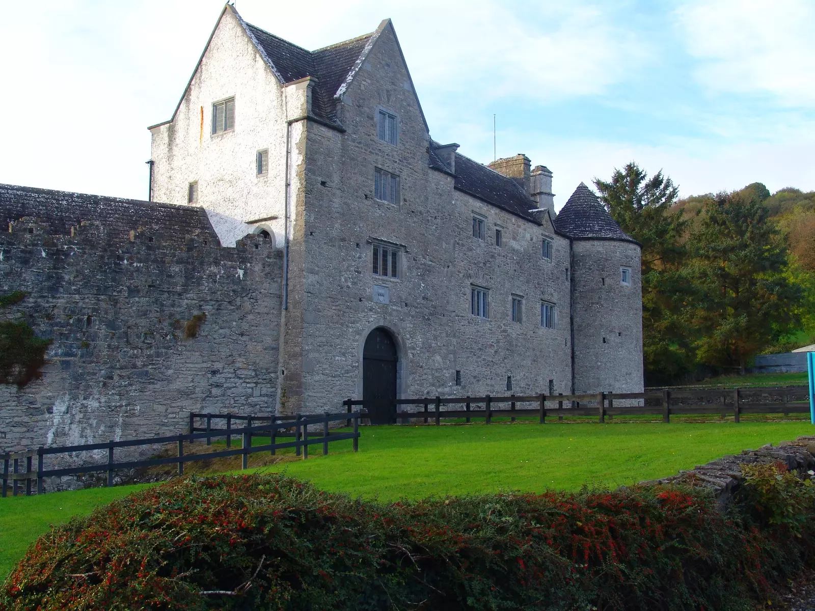 Castle with a green lawn in front.