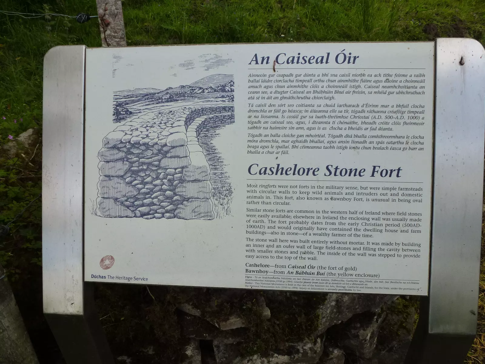 Notice board with information about stone fort in Irish and English