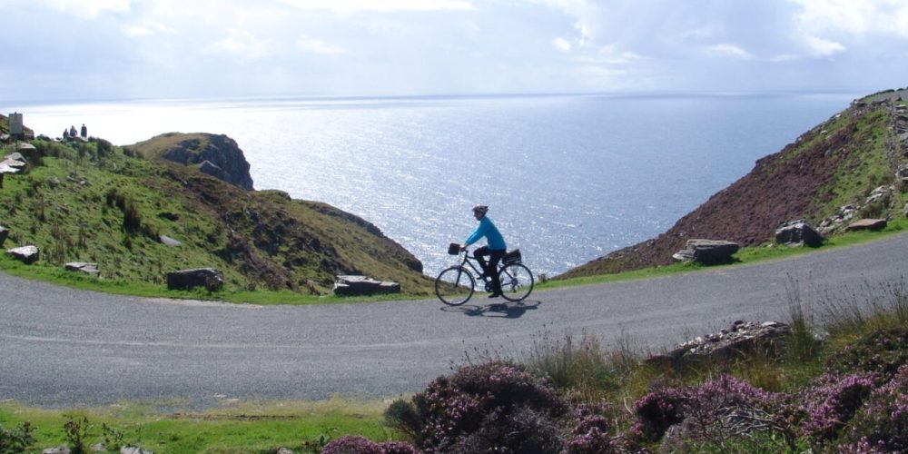 Staff member Cormac cycling at Sliabh Liag (Slieve League)